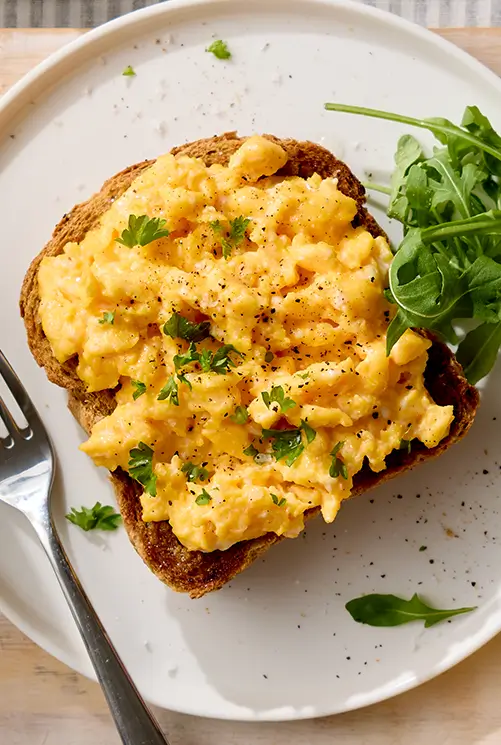 Scrambled eggs served on toast