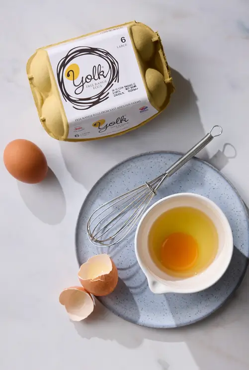 Whisking eggs in a mixing bowl